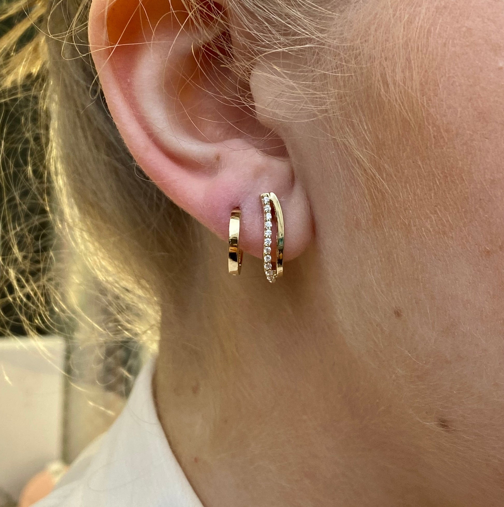 NJO 9ct gold CZ hoop earrings with a polished finish, showcasing their classic circular design and sparkling cubic zirconia stones.