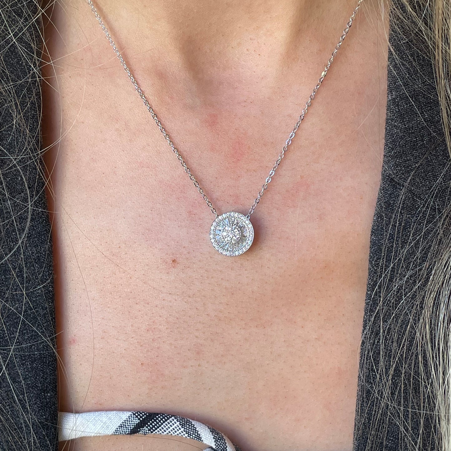 Silver CZ halo cluster necklace with baguette stones by Comero, featuring a delicate chain and sparkling gemstone accents.