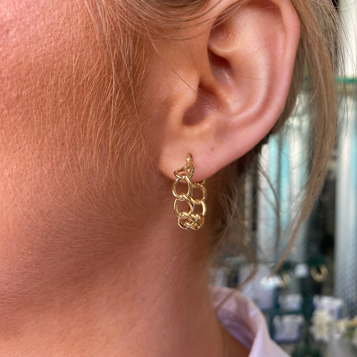 Pair of 9ct gold curb link hoop earrings by Mark Milton, showcasing shiny, interconnected gold hoops on a white background.