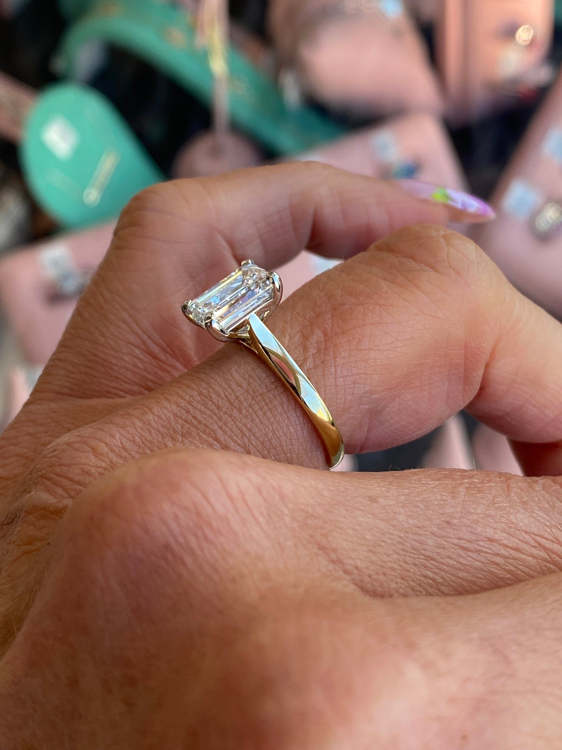 18ct gold emerald cut solitaire engagement ring with a 2.58ct certified lab-grown emerald diamond by Domino.