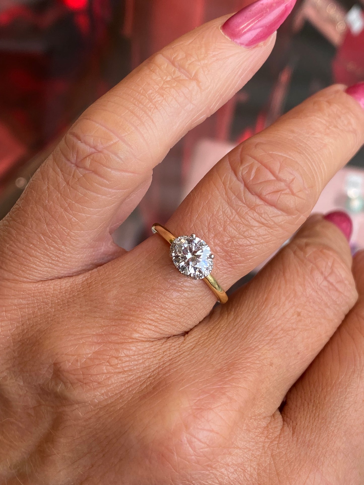 18ct gold Chevron halo solitaire engagement ring by Domino featuring a 1.01ct certificated lab diamond with intricate halo design.