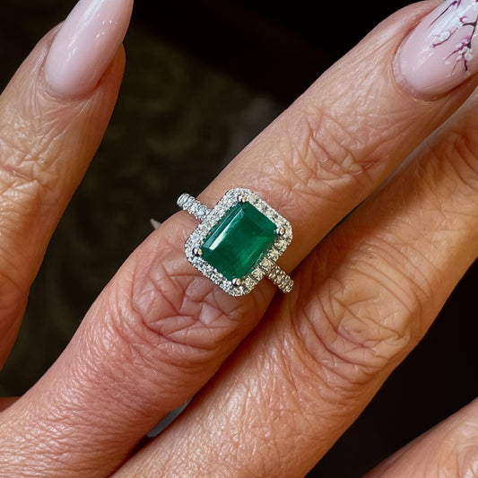 Herbert platinum emerald and diamond octagon ring with intricate design and sparkling gemstones.