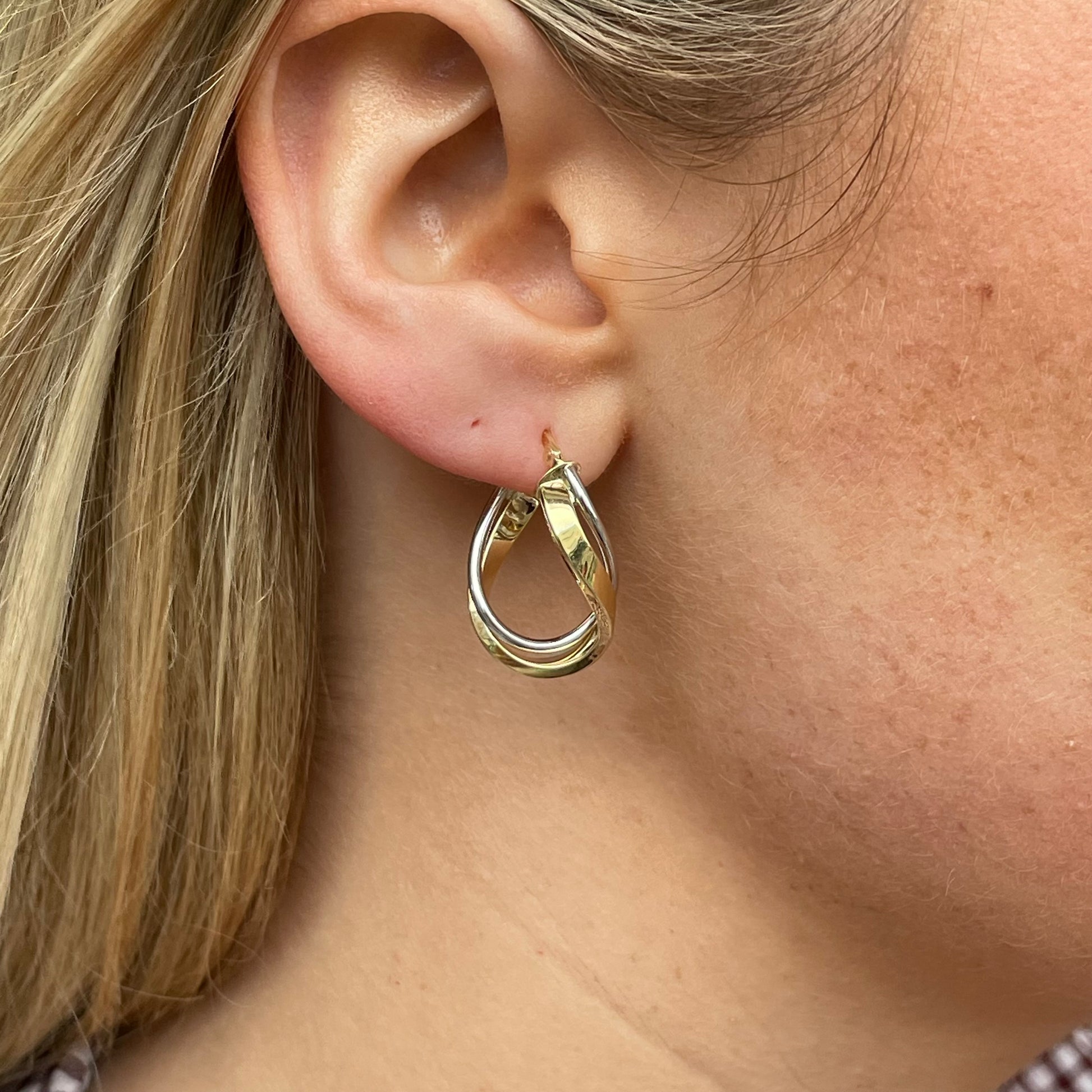 Two-tone 9ct gold swirl hoop earrings by Mark Milton, featuring a stylish spiral design and polished finish.