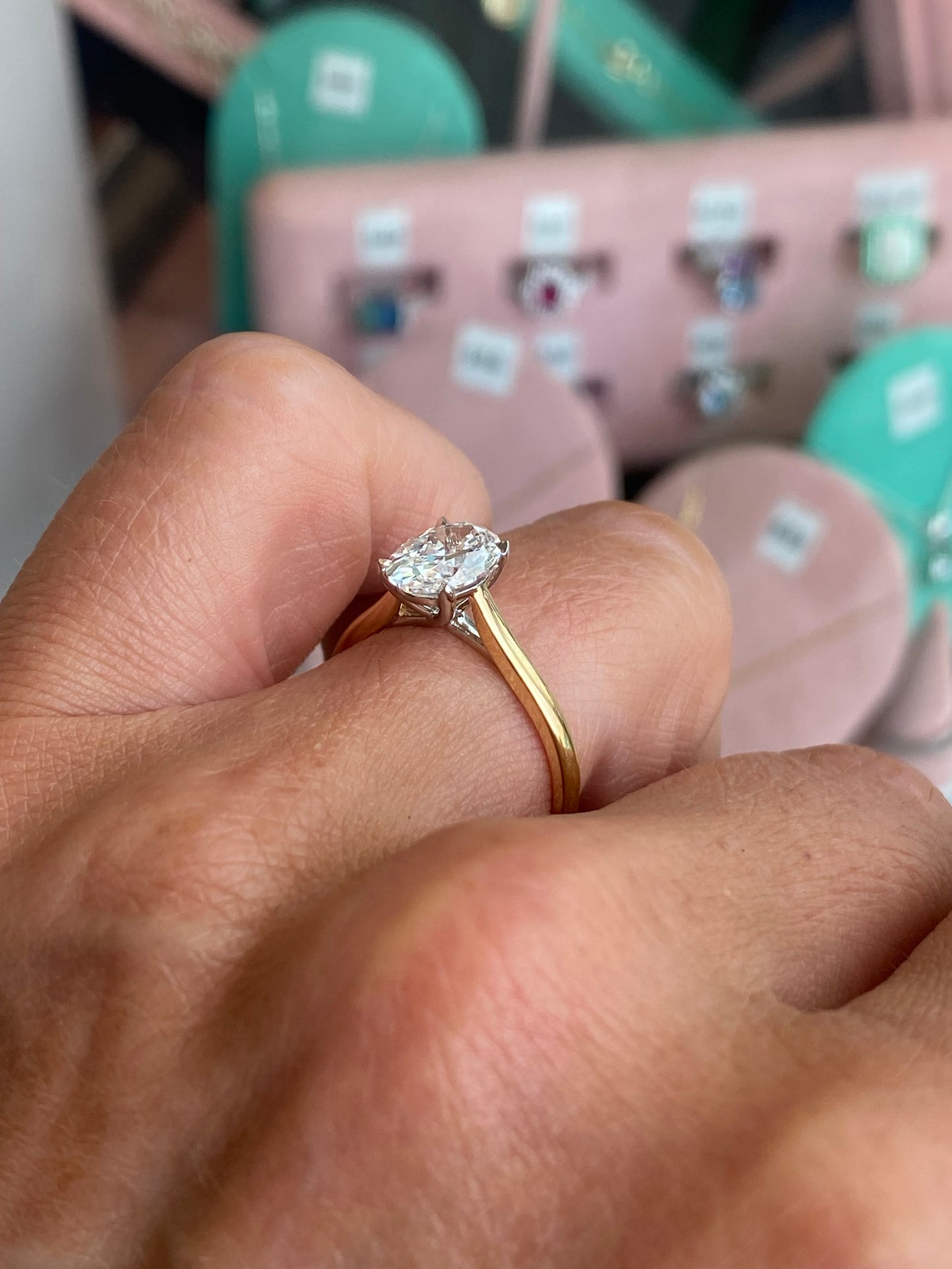 18ct gold oval solitaire engagement ring with a 1.51ct certified lab diamond, featuring a sleek band and elegant design.