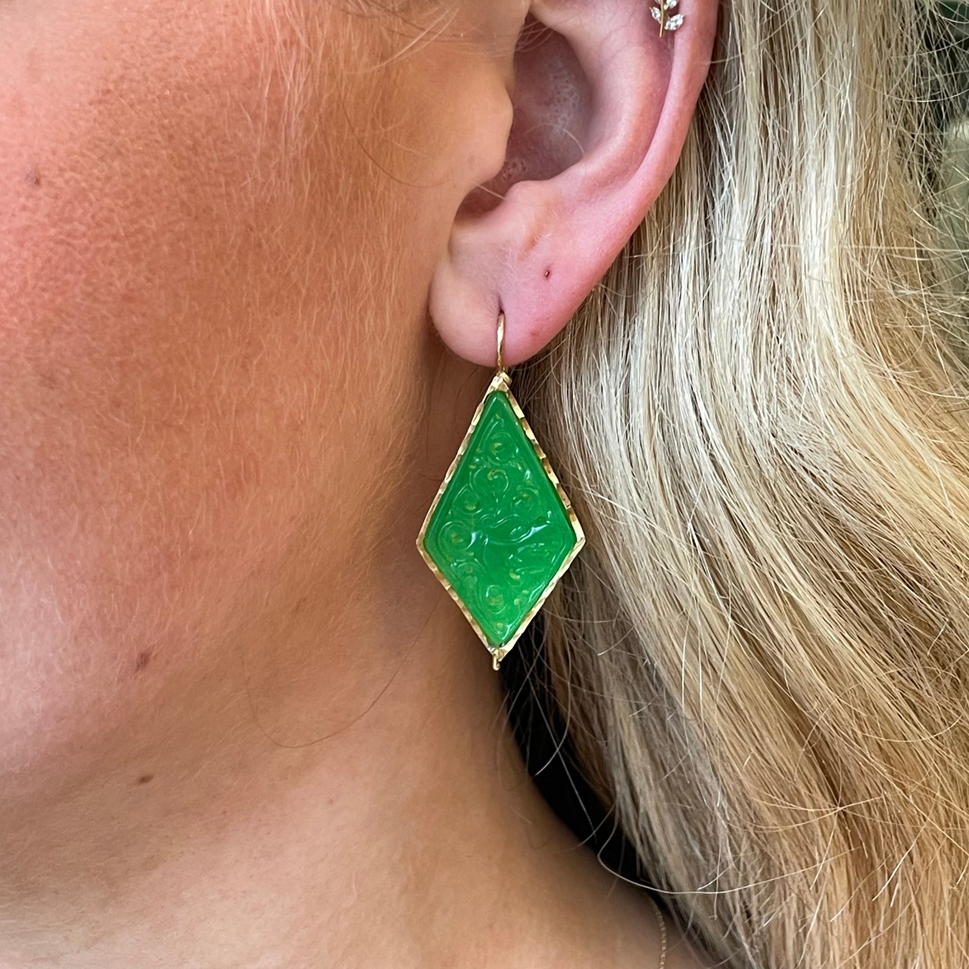 Bruno carved jade kite hook drop earrings featuring intricate jade carvings and elegant dangle design.
