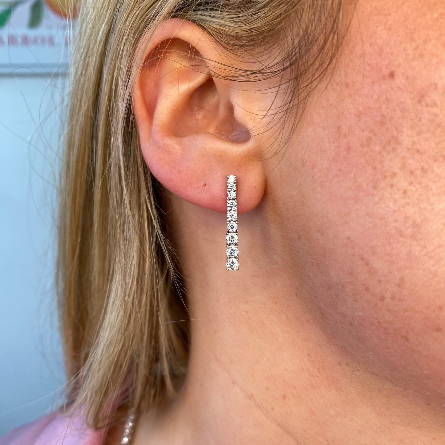 Silver Trisha Drop Earrings by Comero featuring elegant, dangling earrings with a polished silver finish and intricate design.