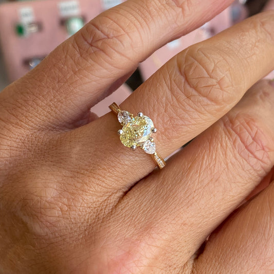18ct gold yellow oval solitaire engagement ring with 1.50ct certified lab diamond, featuring a classic design and smooth band.