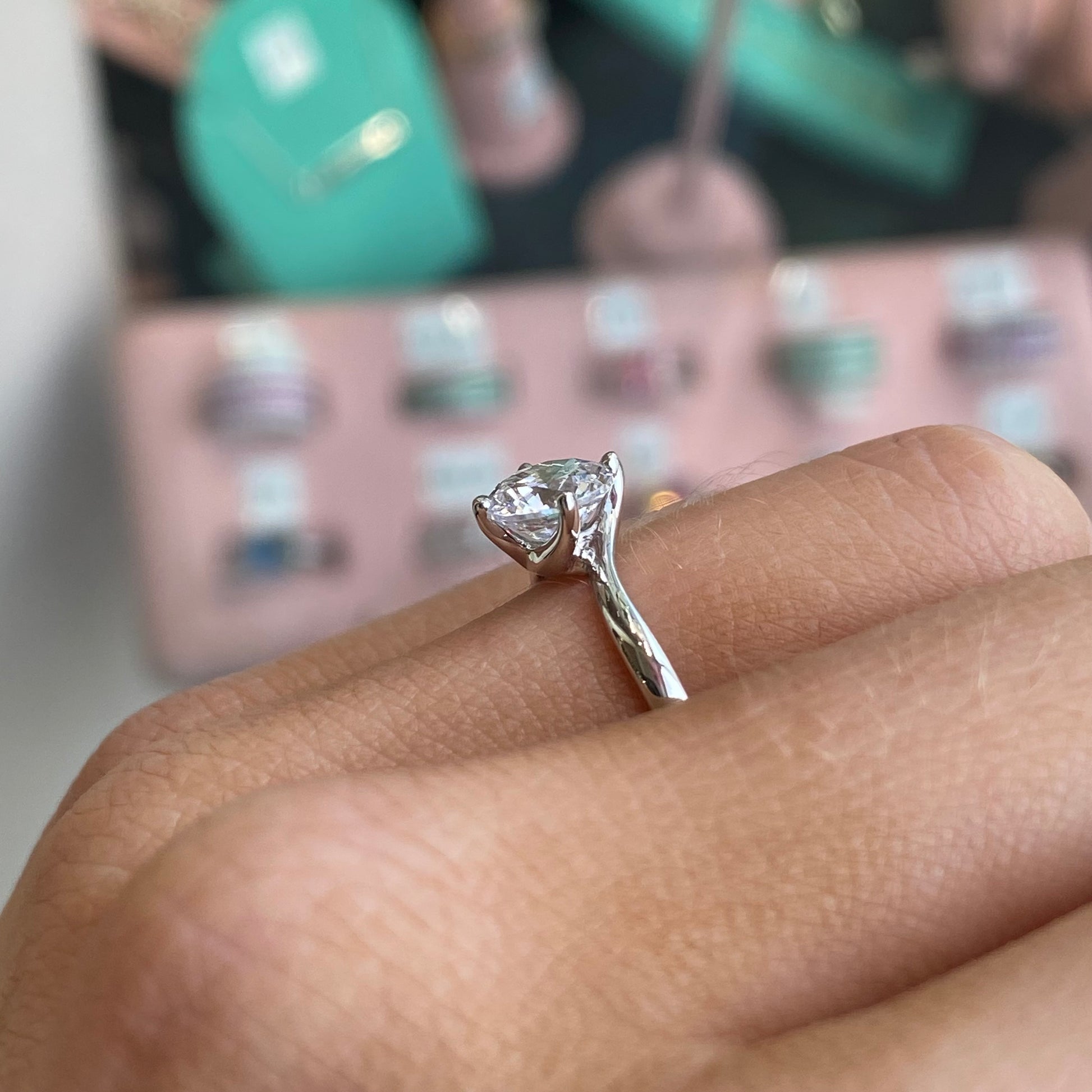 Silver Elegant CZ Twist Promise Ring by CME featuring a shimmering twisted design and sparkling cubic zirconia accents.