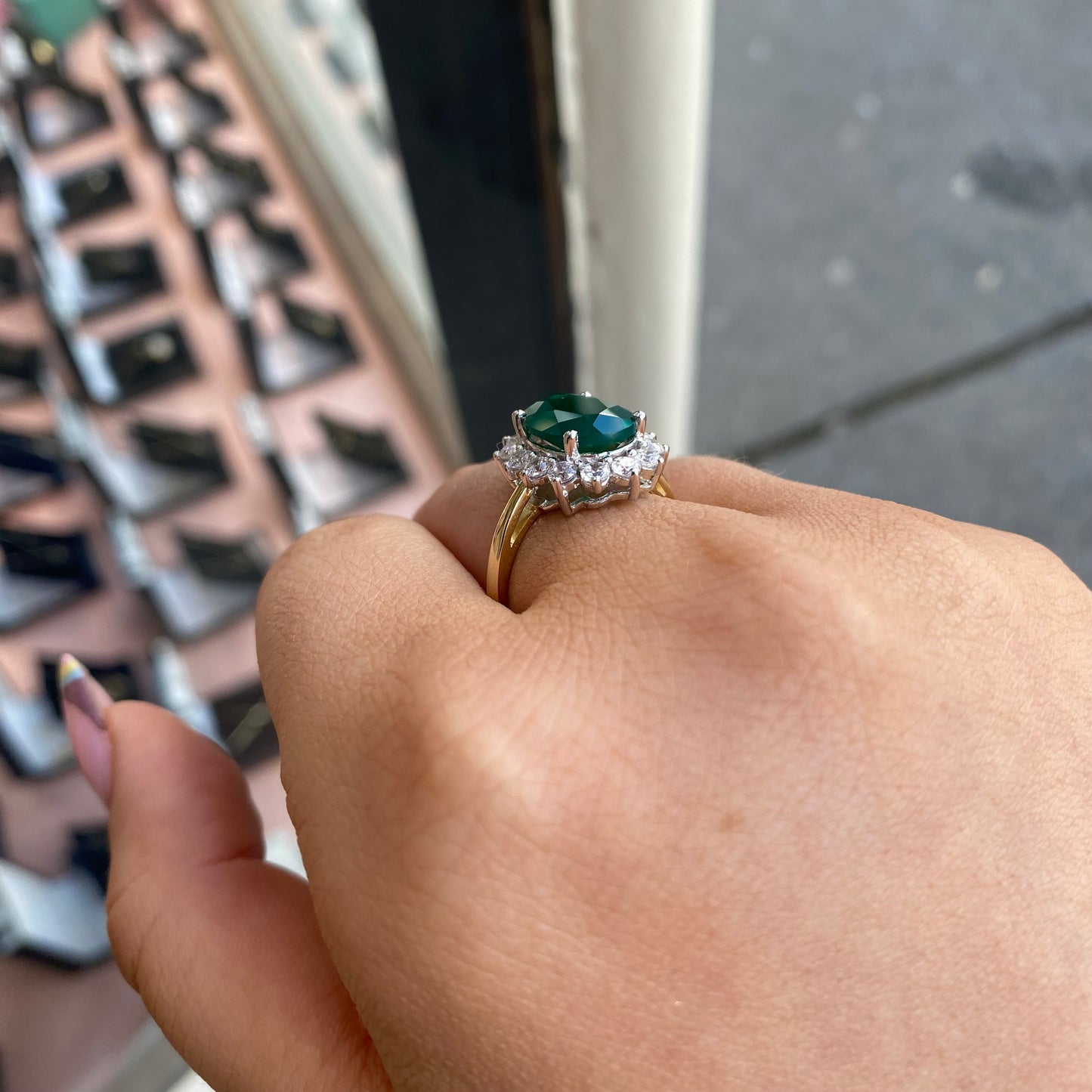 9ct gold created emerald and CZ oval cluster ring by PJD, featuring a sparkling gemstone design and elegant craftsmanship.