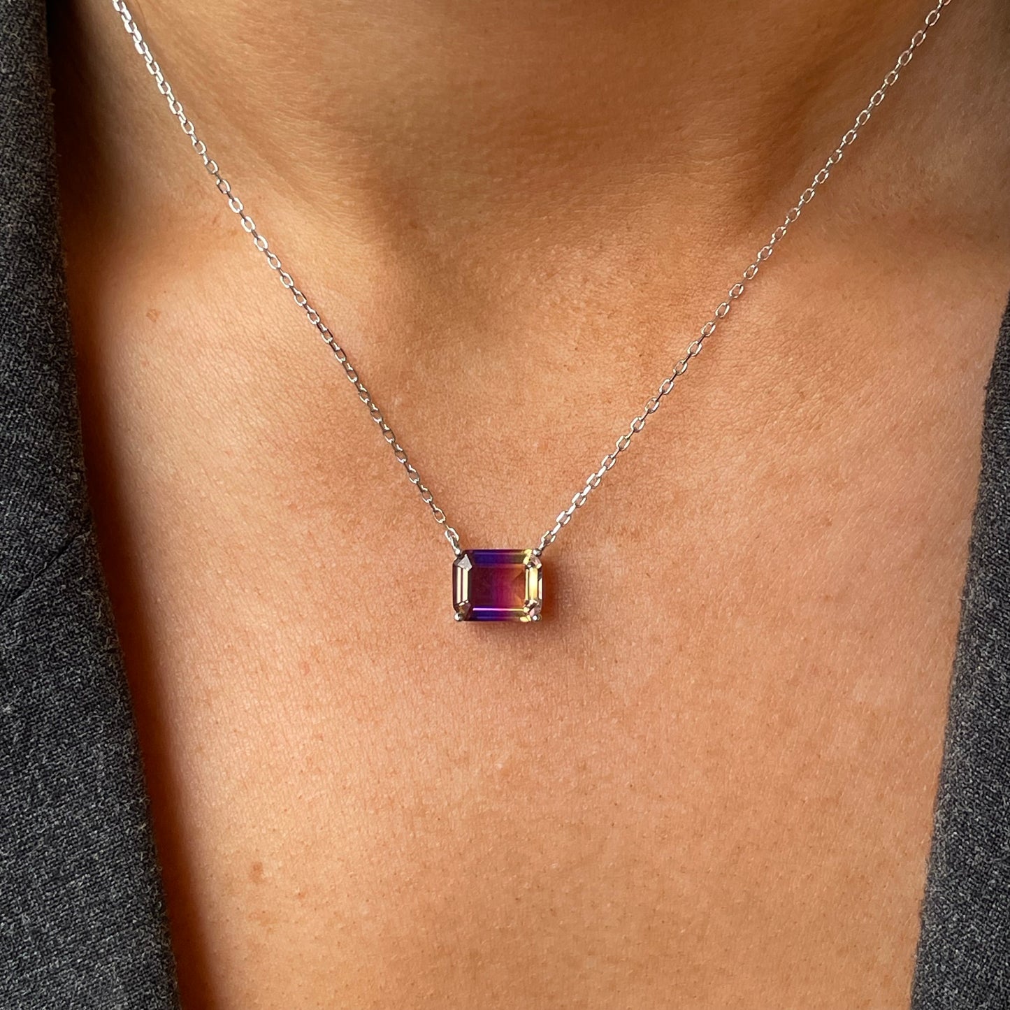 Silver side to side CZ necklace by Comero with 40+5cm chain, featuring sparkling cubic zirconia stones on a sleek silver pendant.