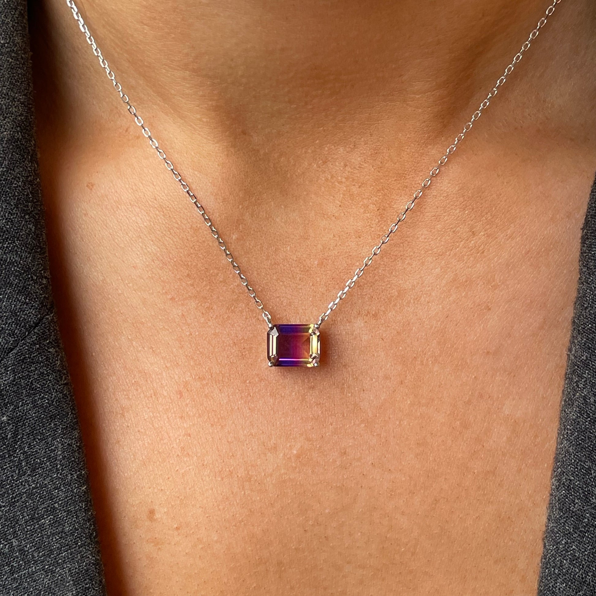 Silver side to side CZ necklace by Comero with 40+5cm chain, featuring sparkling cubic zirconia stones on a sleek silver pendant.