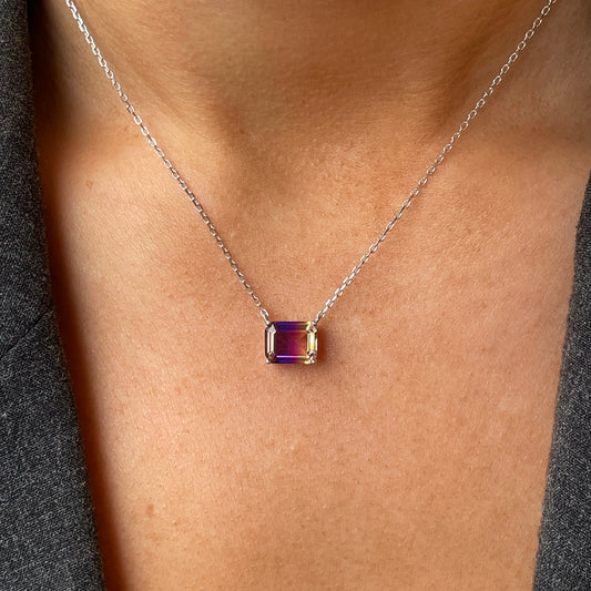 Silver side to side CZ necklace by Comero with 40+5cm chain, featuring sparkling cubic zirconia stones on a sleek silver pendant.