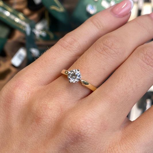 18ct gold solitaire engagement ring with 0.74ct lab-grown diamond from Prima, showcasing a sleek band and sparkling central stone.