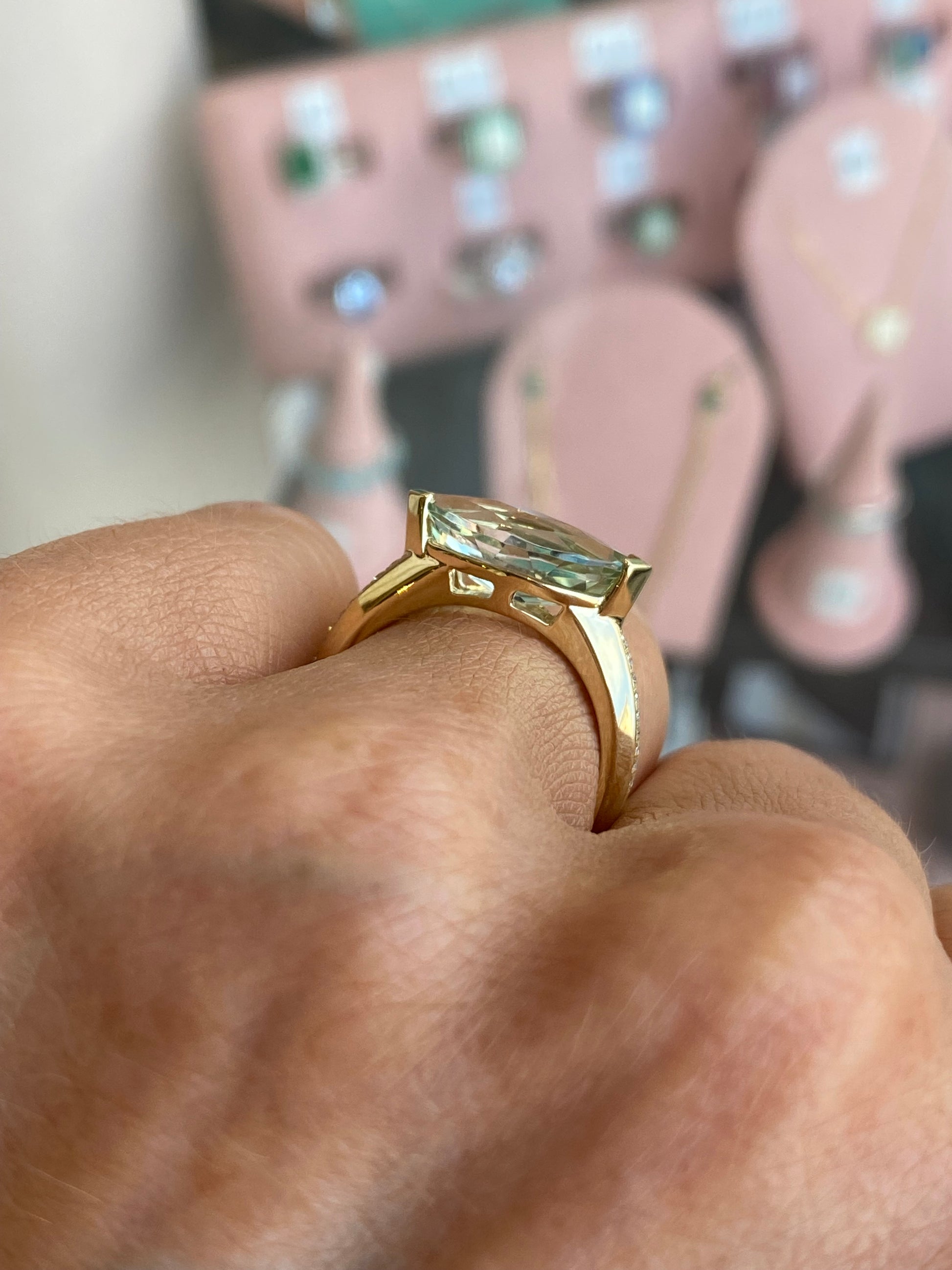 9ct gold green amethyst and diamond ring featuring a central green amethyst gemstone with diamond accents, crafted by TCA.