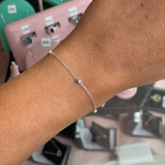 Silver Pretty Cubes bracelet by CME featuring sleek cube-shaped links on a delicate chain.