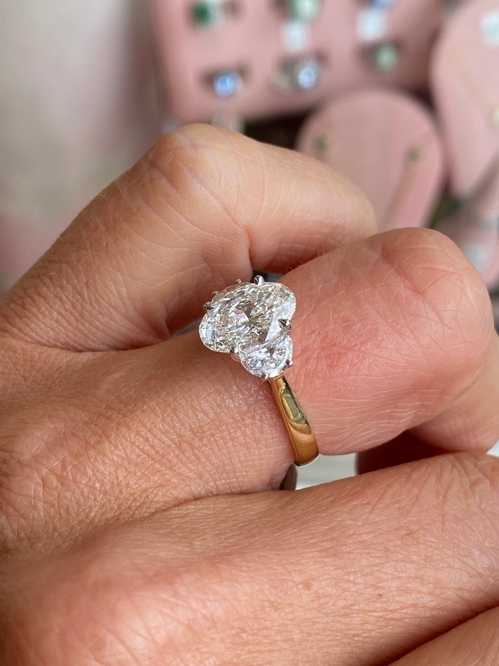18ct gold trilogy engagement ring by TCA with a lab-certified 2.52ct central diamond and two side diamonds, elegant and sparkling.