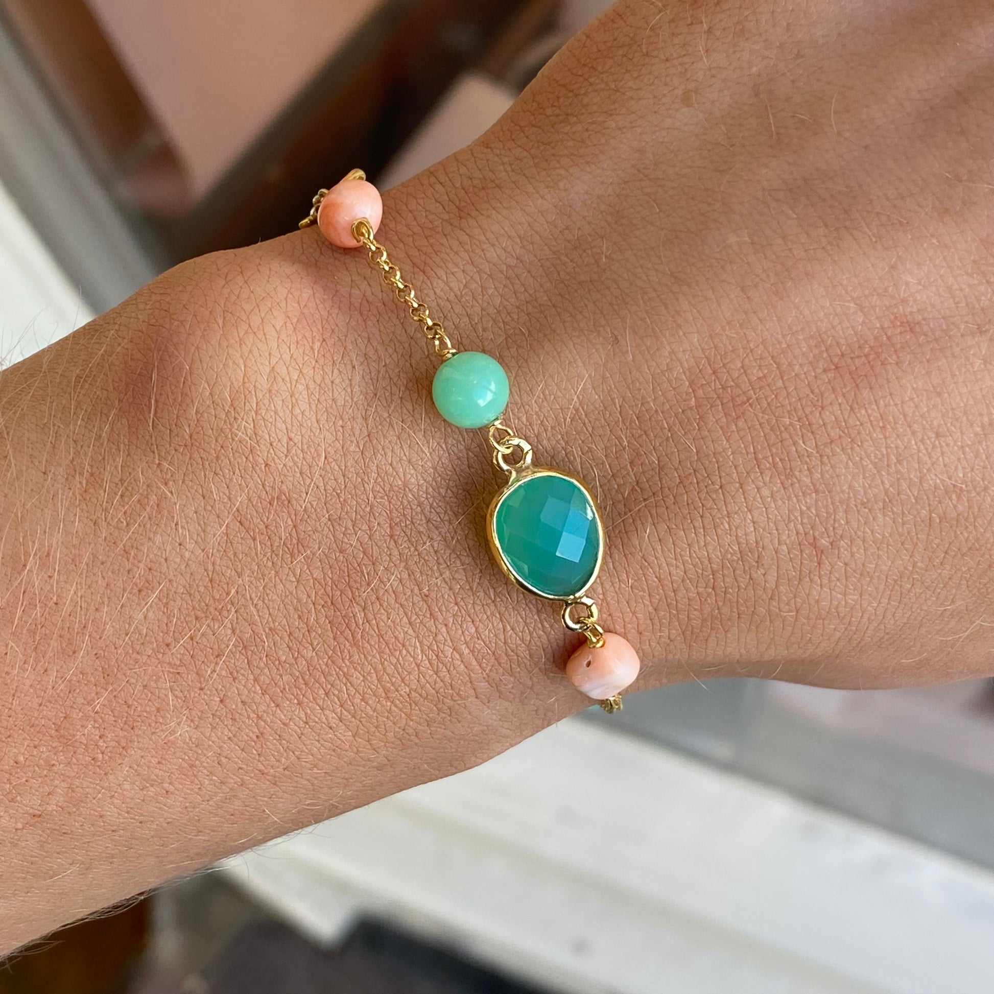 Bruno jade, rose coral, and quartz bracelet with mixed stone beads on an elastic band, stylish and vibrant jewelry accessory.