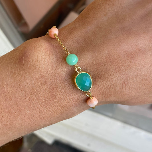 Bruno jade, rose coral, and quartz bracelet with mixed stone beads on an elastic band, stylish and vibrant jewelry accessory.