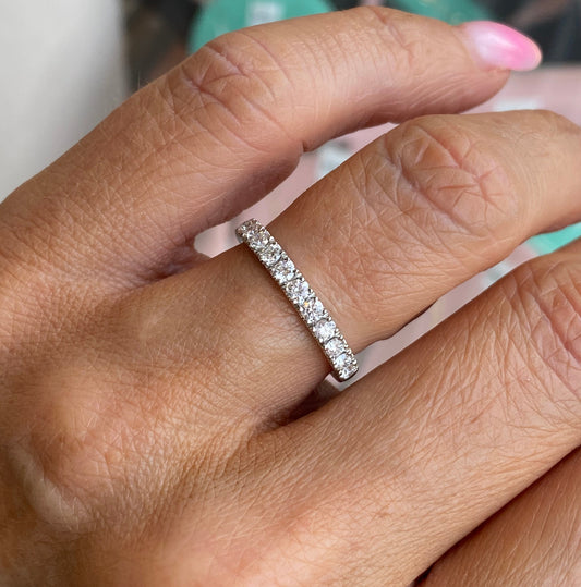 Lanza platinum diamond wedding band with 0.50ct diamond set, showcasing a sleek eternity design with sparkling stones.