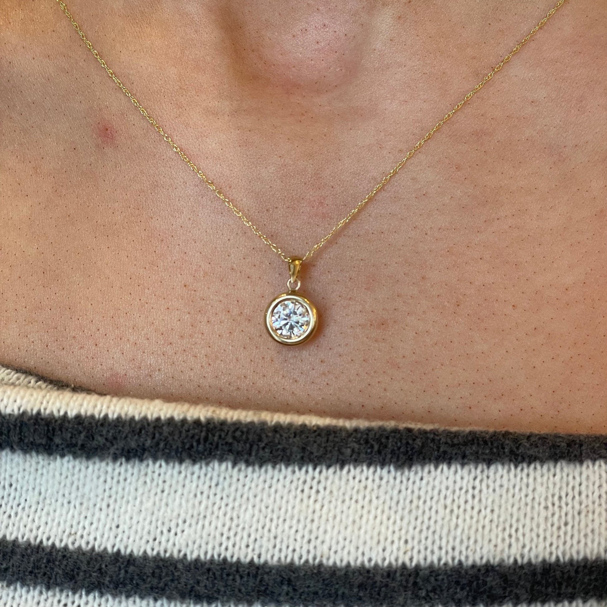 9ct gold bezel set CZ necklace with a 6mm sparkling cubic zirconia, showcasing elegant jewelry design by NJO.
