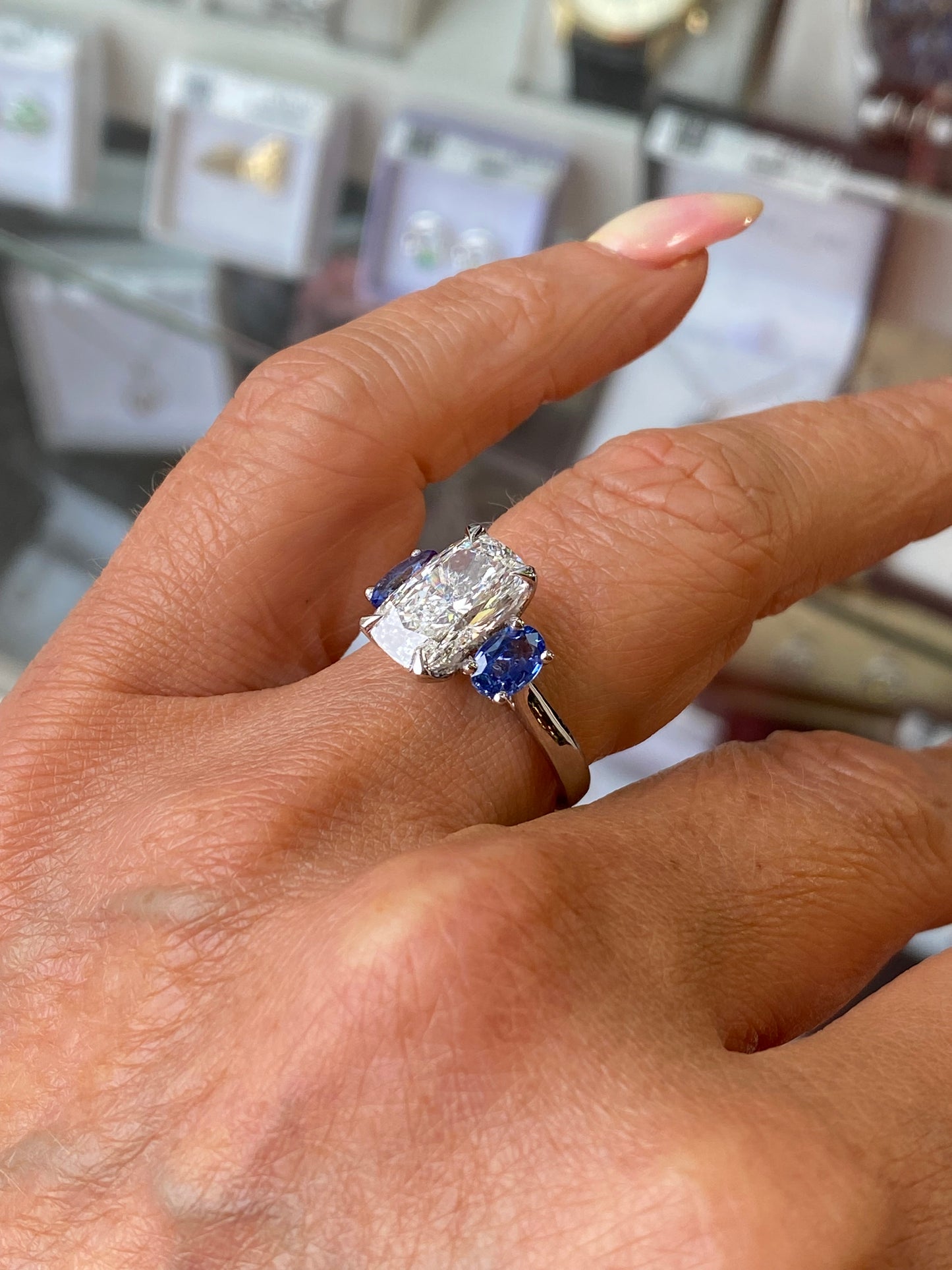 Platinum Elongated Cushion & Sapphire Trilogy Ring - John Ross Jewellers