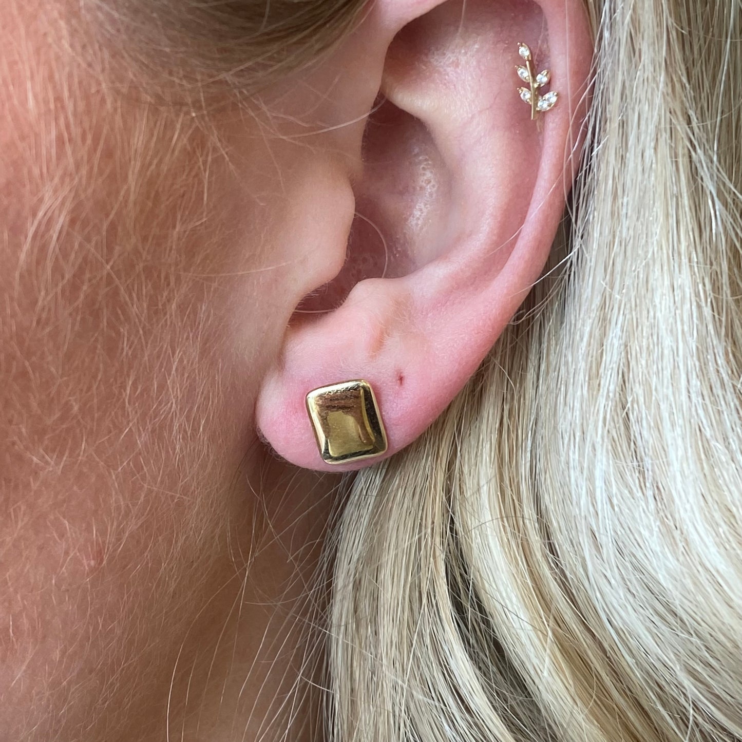 NJO 9ct gold flat rectangular stud earrings with a sleek, minimalist design, showcasing shiny gold finish on a plain background.