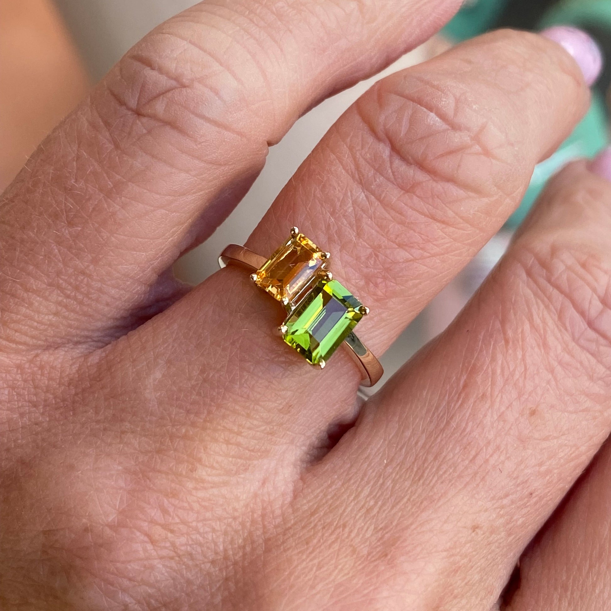 Insignia 9ct gold Moi Et Toi ring featuring a vibrant citrine and peridot gemstones set in a elegant band.