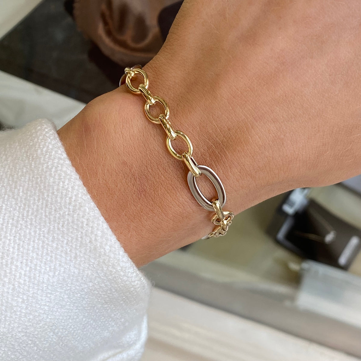 Mark Milton 9ct gold elongated oval link two-tone bracelet with polished finish and intricate link design.