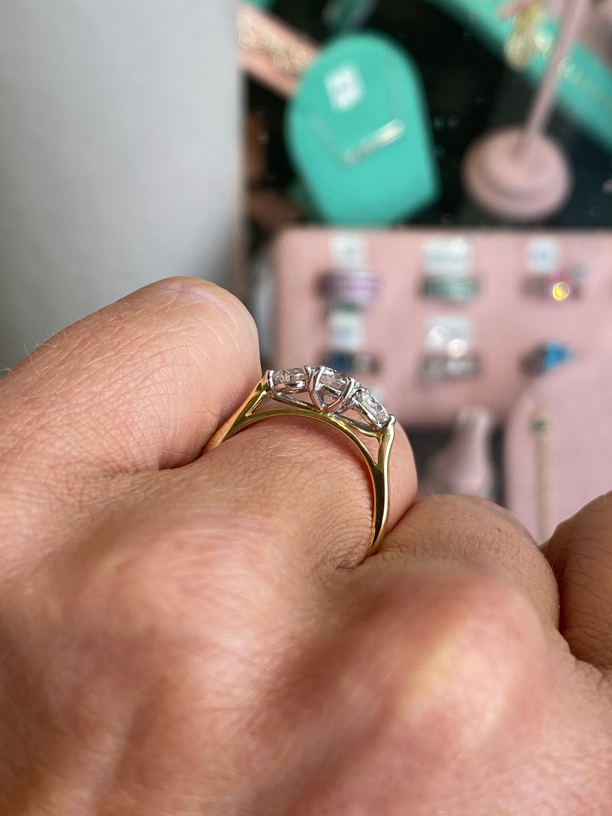 18ct gold trilogy diamond ring by FEU with 1.00ct total diamond weight, showcasing three sparkling diamonds on a polished gold band.