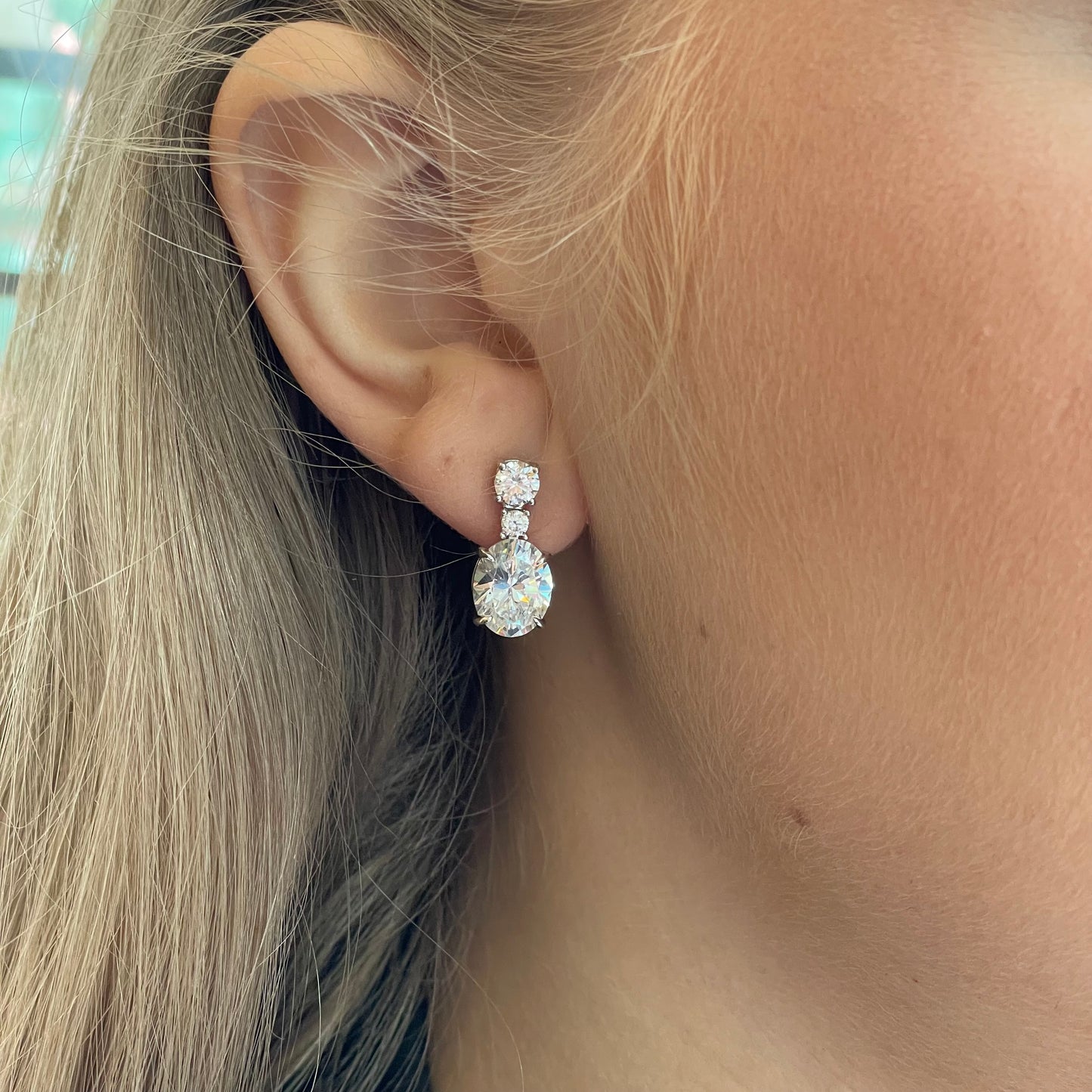Silver C-Flawless Oval CZ Drop Earrings by Insignia featuring sparkling cubic zirconia and sleek oval design.