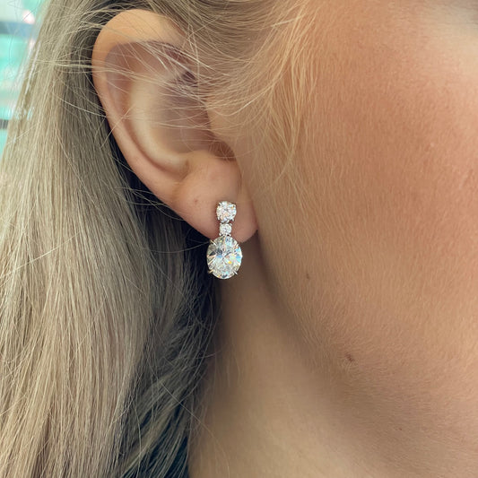 Silver C-Flawless Oval CZ Drop Earrings by Insignia featuring sparkling cubic zirconia and sleek oval design.