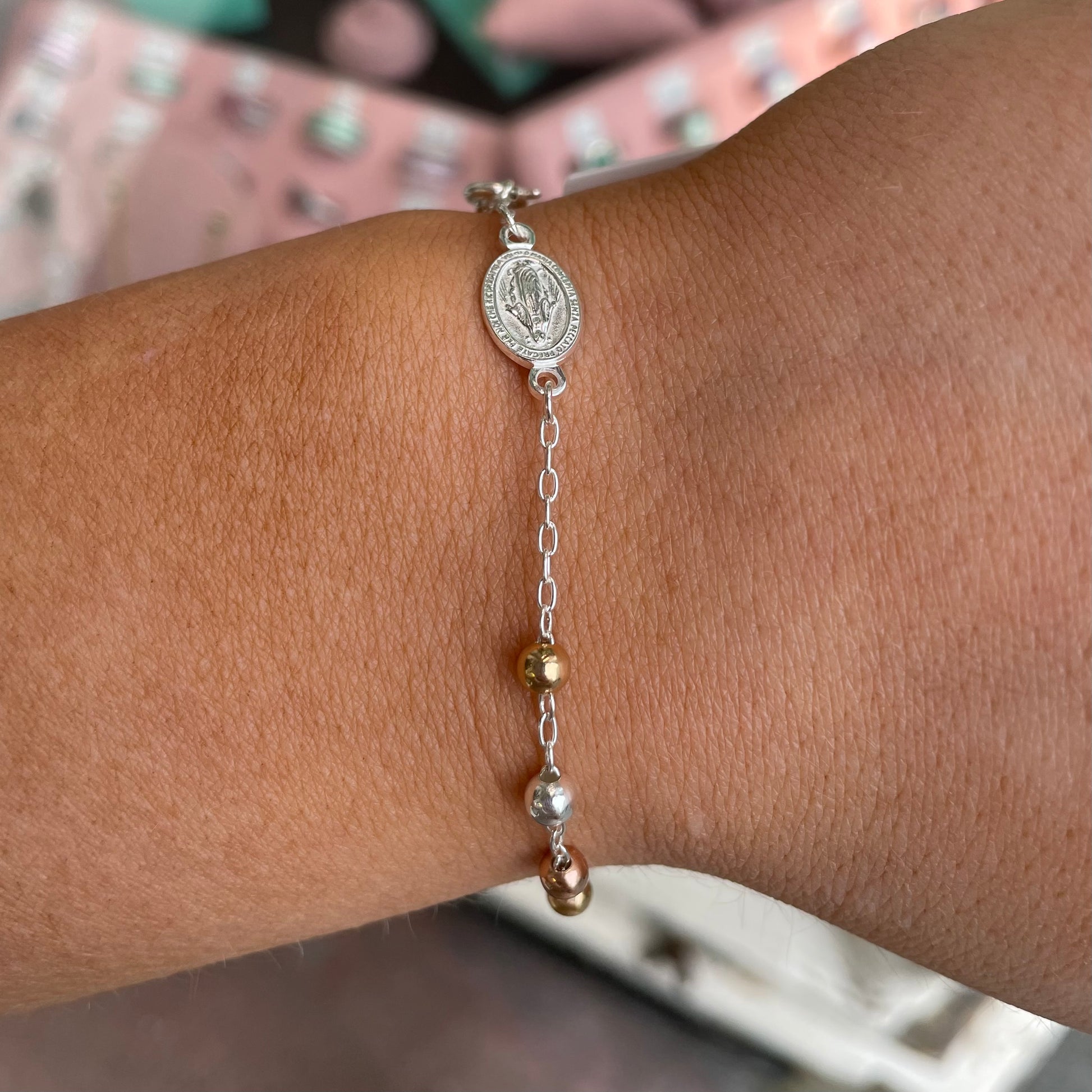 Silver Kurate rosary bracelet with detailed beads and religious charm, designed for elegant, spiritual accessorizing.