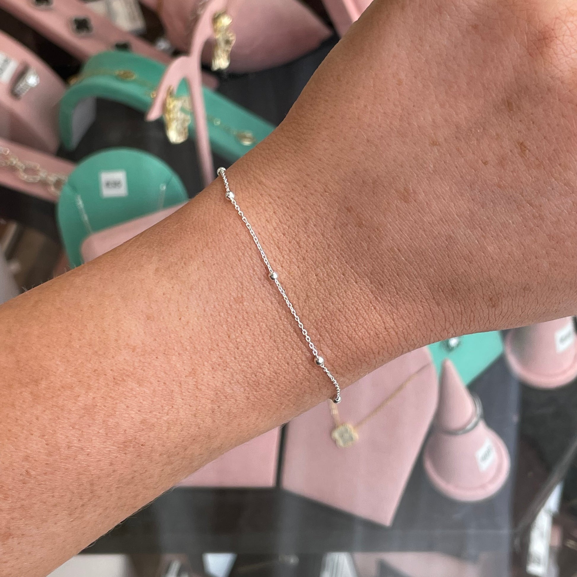 Silver CME Trace & Bead Satellite Bracelet featuring intricate beaded design and delicate chain links.