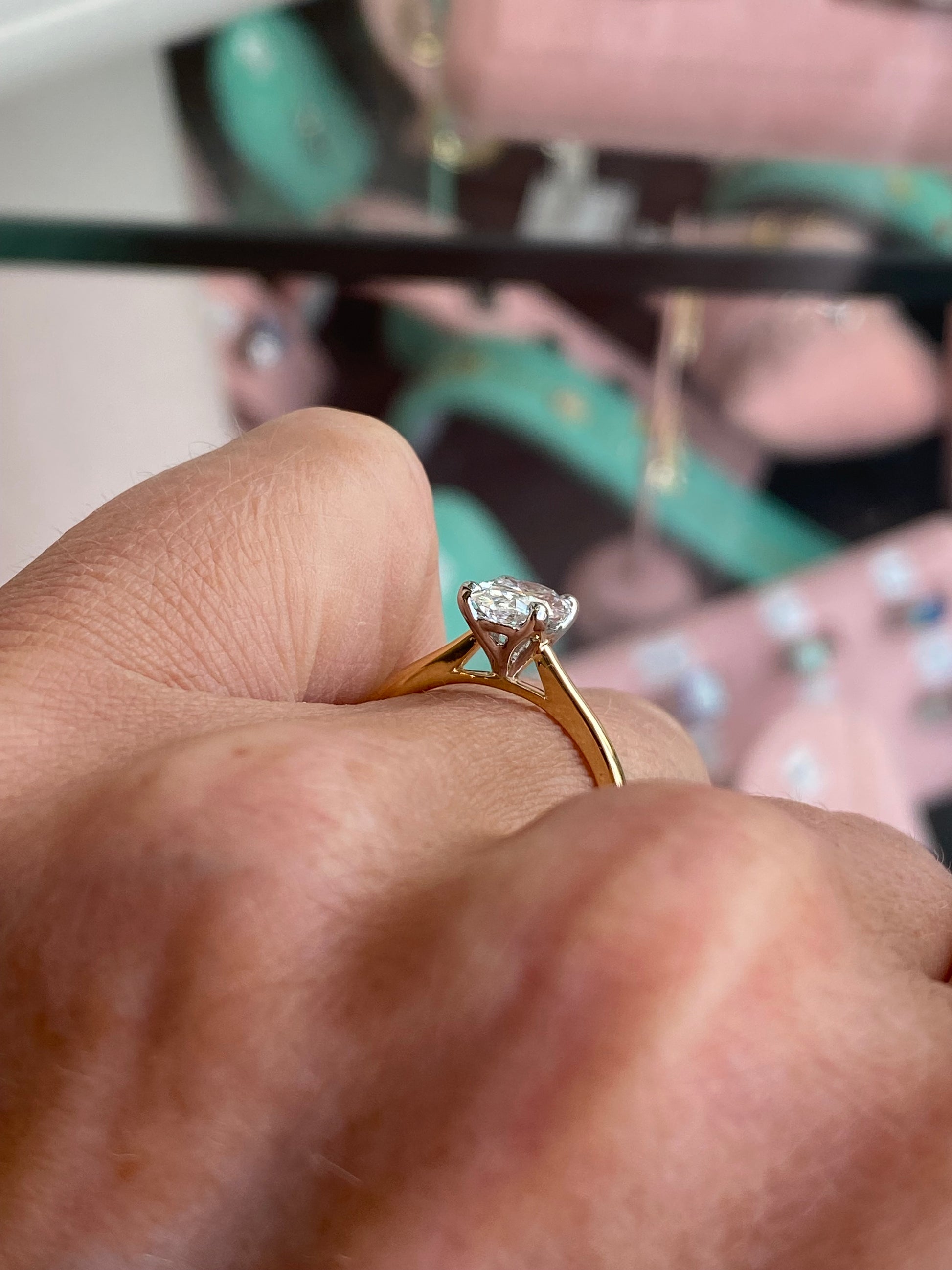 18ct gold oval solitaire engagement ring with a 1.27ct certified diamond, showcasing elegant craftsmanship and a classic design.