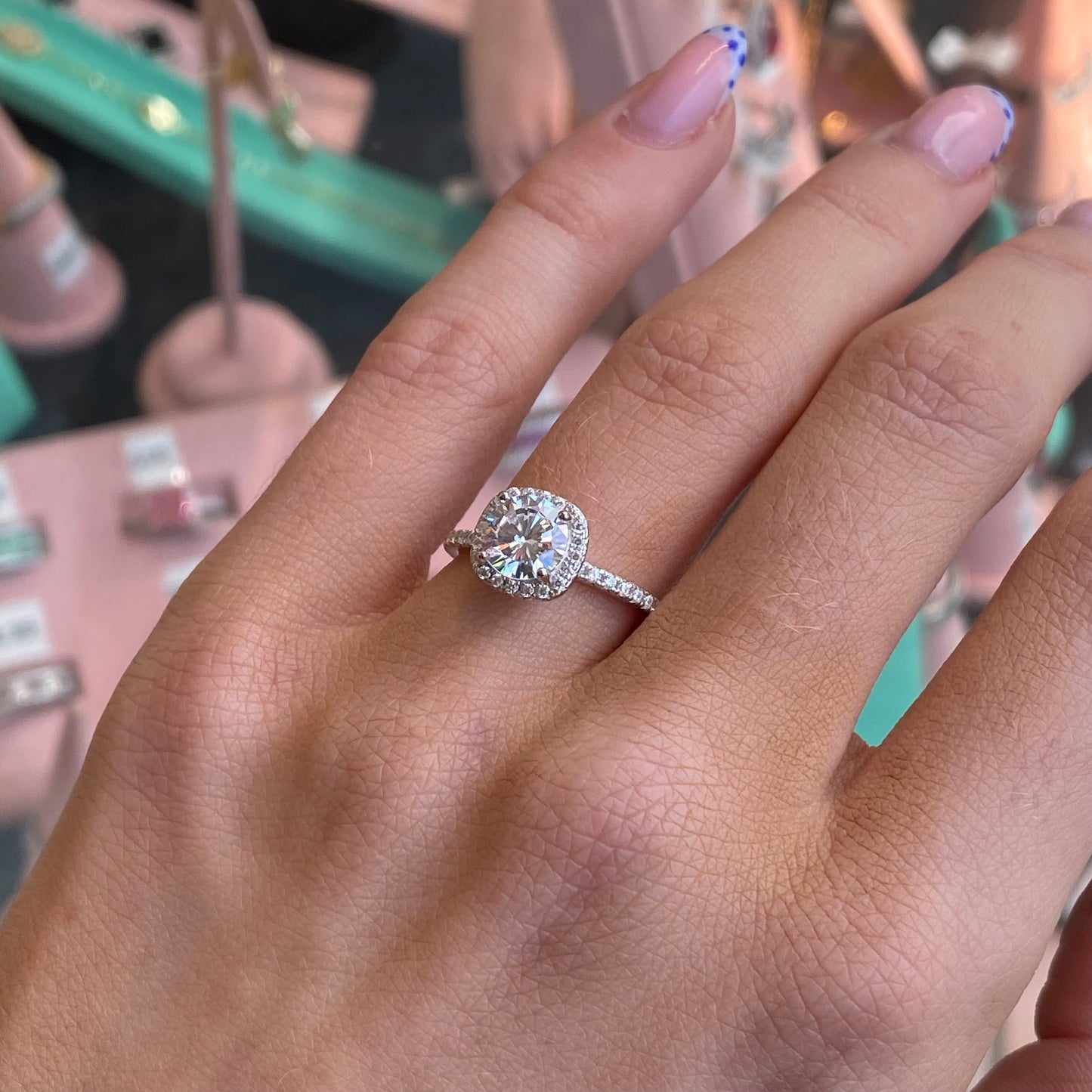 Silver Cushion CZ ring by THC featuring a sparkling cubic zirconia stone set in a sleek silver band.