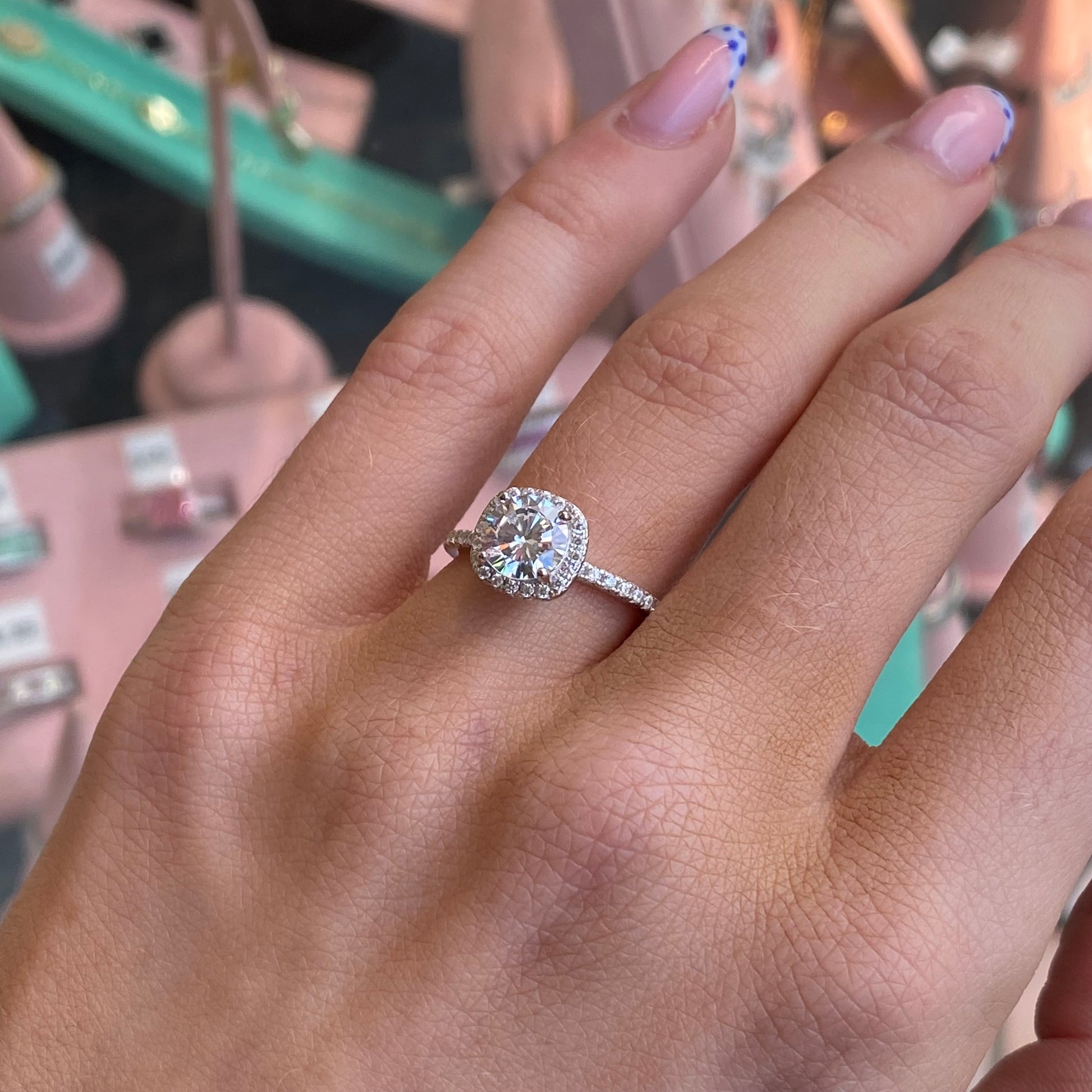 Silver Cushion CZ ring by THC featuring a sparkling cubic zirconia stone set in a sleek silver band.