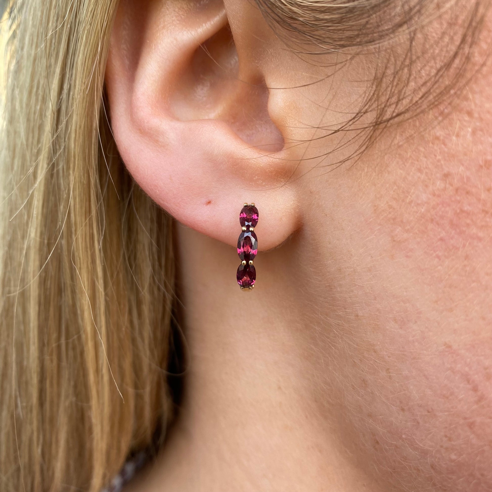 9ct gold garnet huggie hoop earrings by Mark Milton, 15mm size, featuring red garnet gemstones in a stylish hoop earring design.