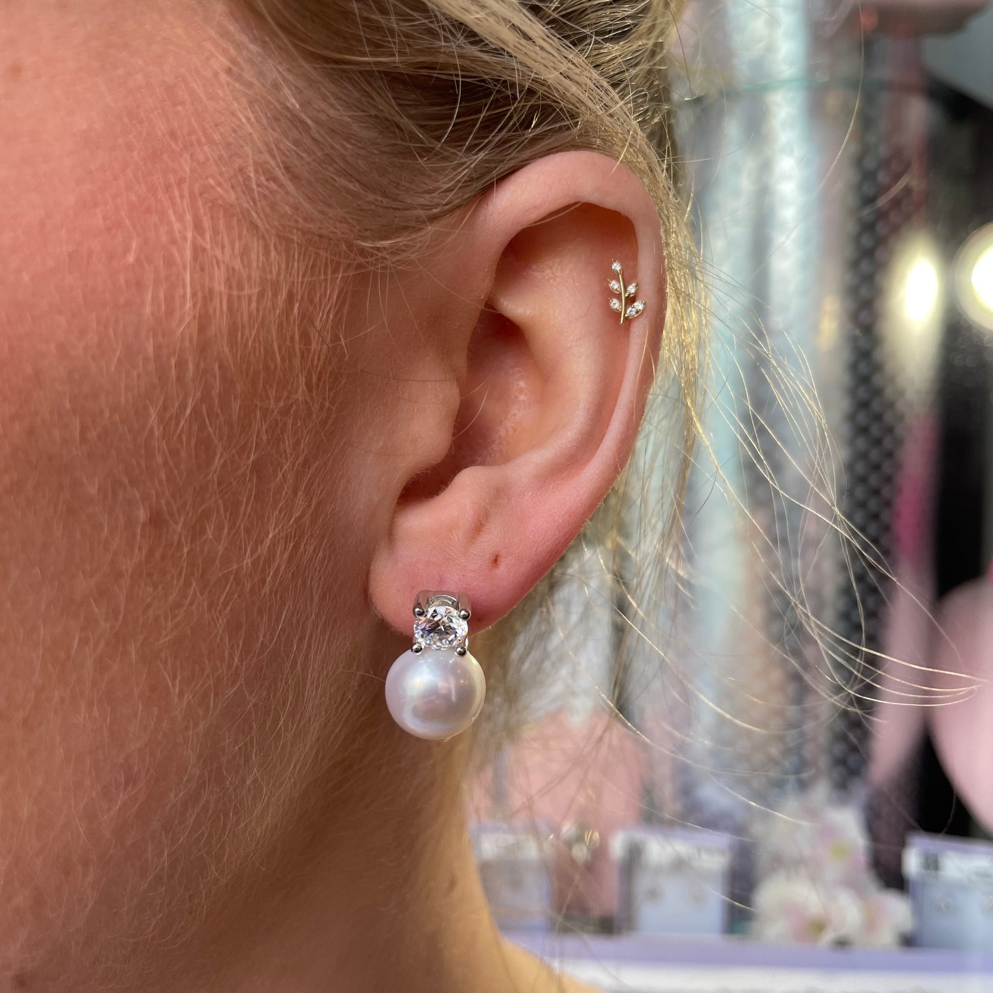 Silver CZ and freshwater pearl earrings with German wires, featuring 11-12mm pearls and sparkling cubic zirconia accents.