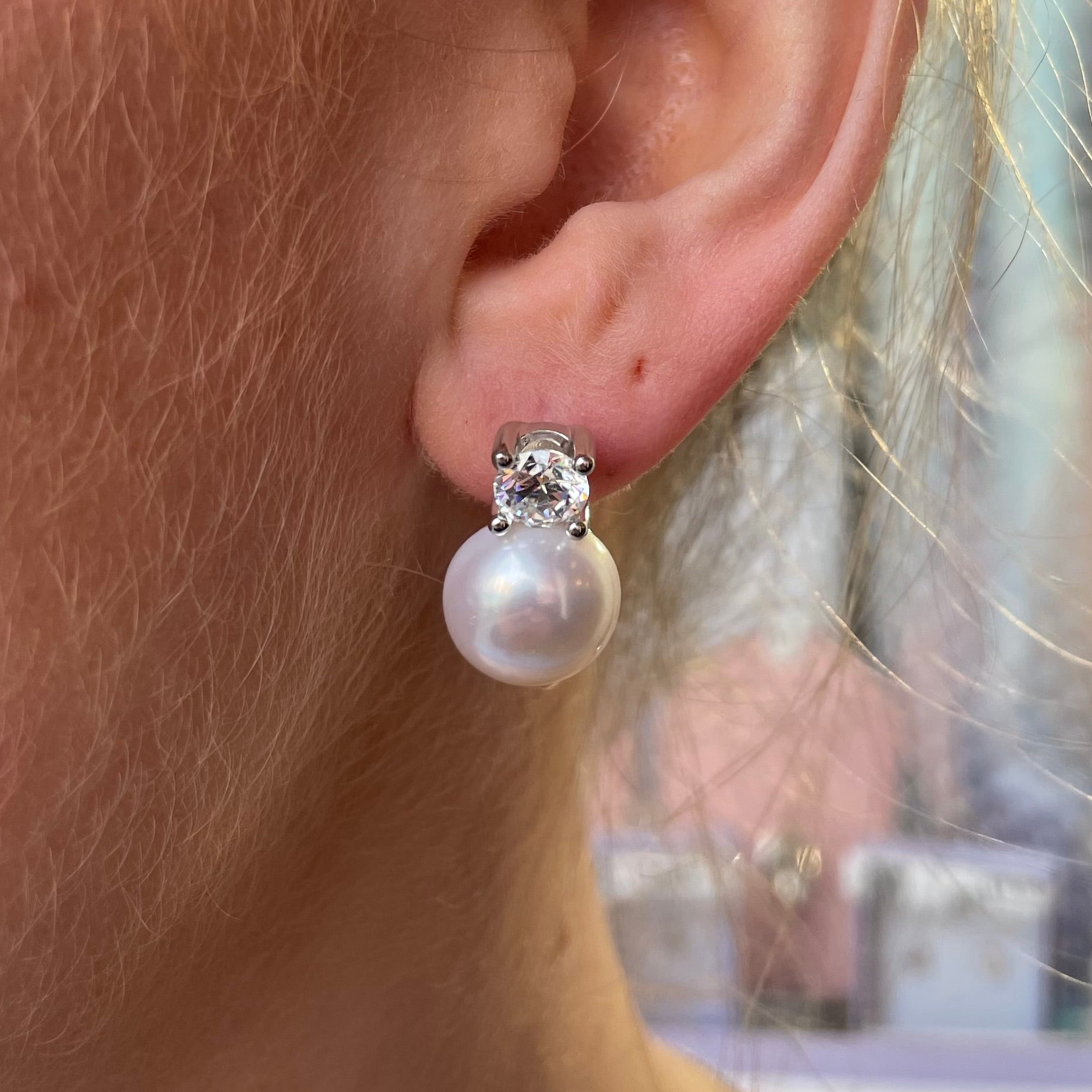 Silver CZ and freshwater pearl earrings with German wires, featuring 11-12mm pearls and elegant silver accents.