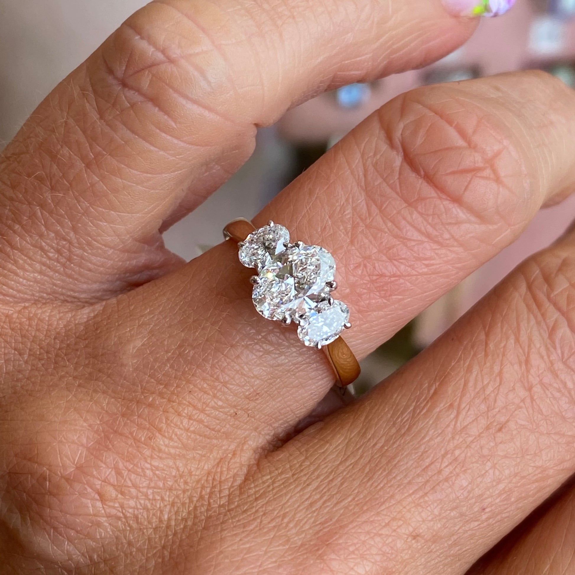 18ct gold oval trilogy engagement ring by TCA with 1.58ct lab-certified diamonds, featuring a classic and elegant design.