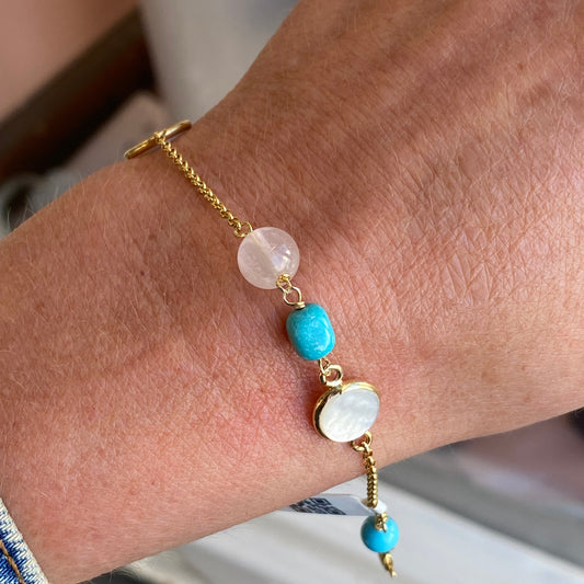 Bruno turquoise, pearl, and mother of pearl bracelet featuring a delicate design with vibrant gemstones and shiny accents.