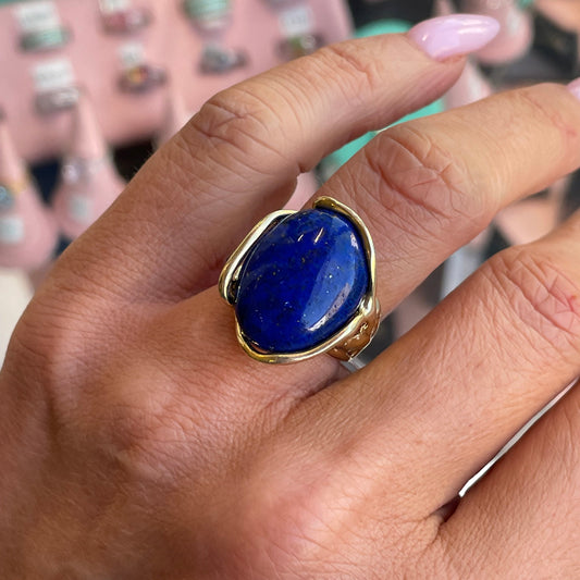 Bruno Lapis Lazuli oval ring with a polished blue gemstone set in a silver band on a white background.