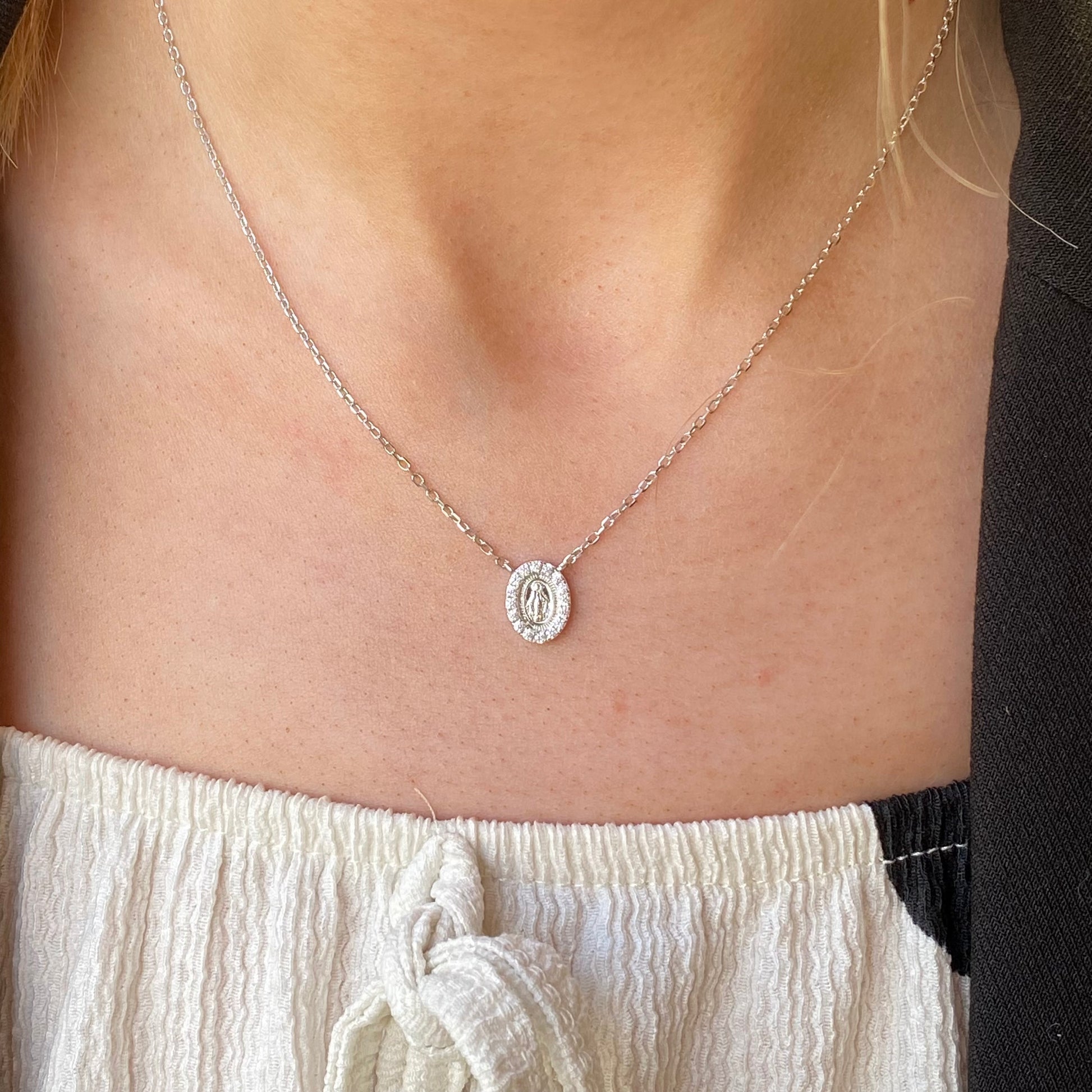Silver CZ Miraculous Necklace by Comero featuring a detailed pendant with sparkling cubic zirconia stones.
