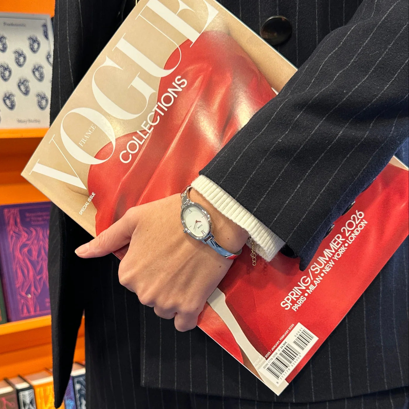 Silver CLUSE L'Ovale watch with a sleek oval face, minimalist design, and silver bracelet, showcasing elegant timepiece craftsmanship.