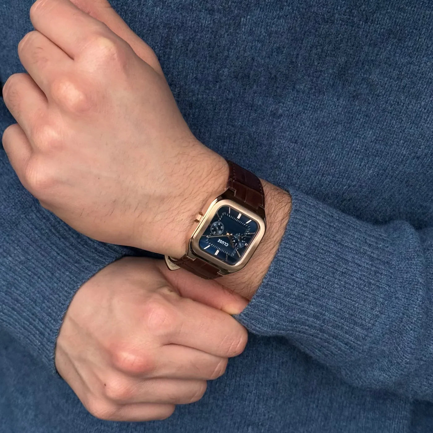 CLUSE Quadrus multifunction leather watch with rose gold and blue accents, featuring a sleek design and elegant metal case.