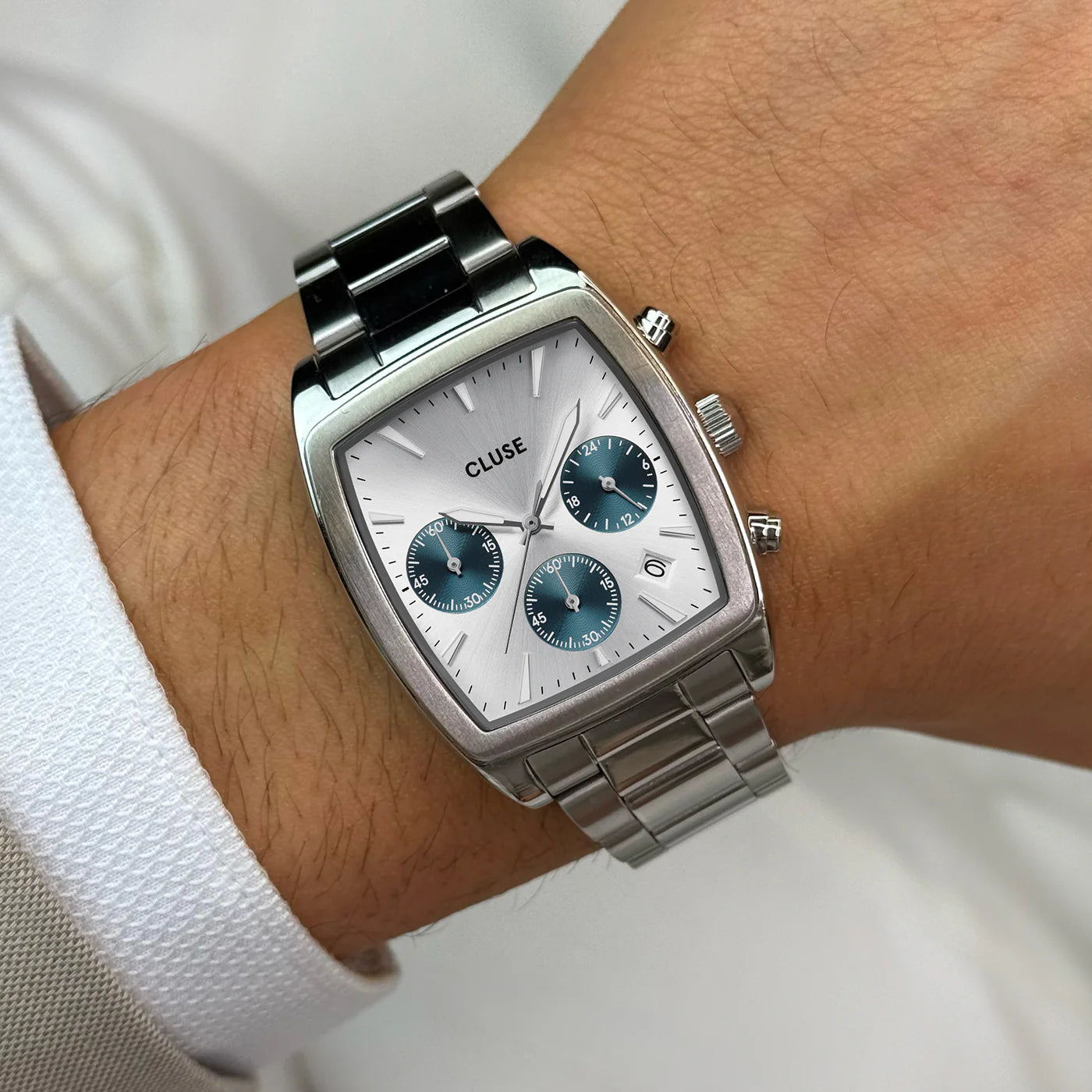 Silver and blue CLUSE Quartaut Chrono steel watch with a round dial and minimalist design.