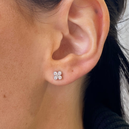 Silver CZ quatrefoil stud earrings by Insignia, close-up of elegant earrings with sparkling cubic zirconia in a quatrefoil design.