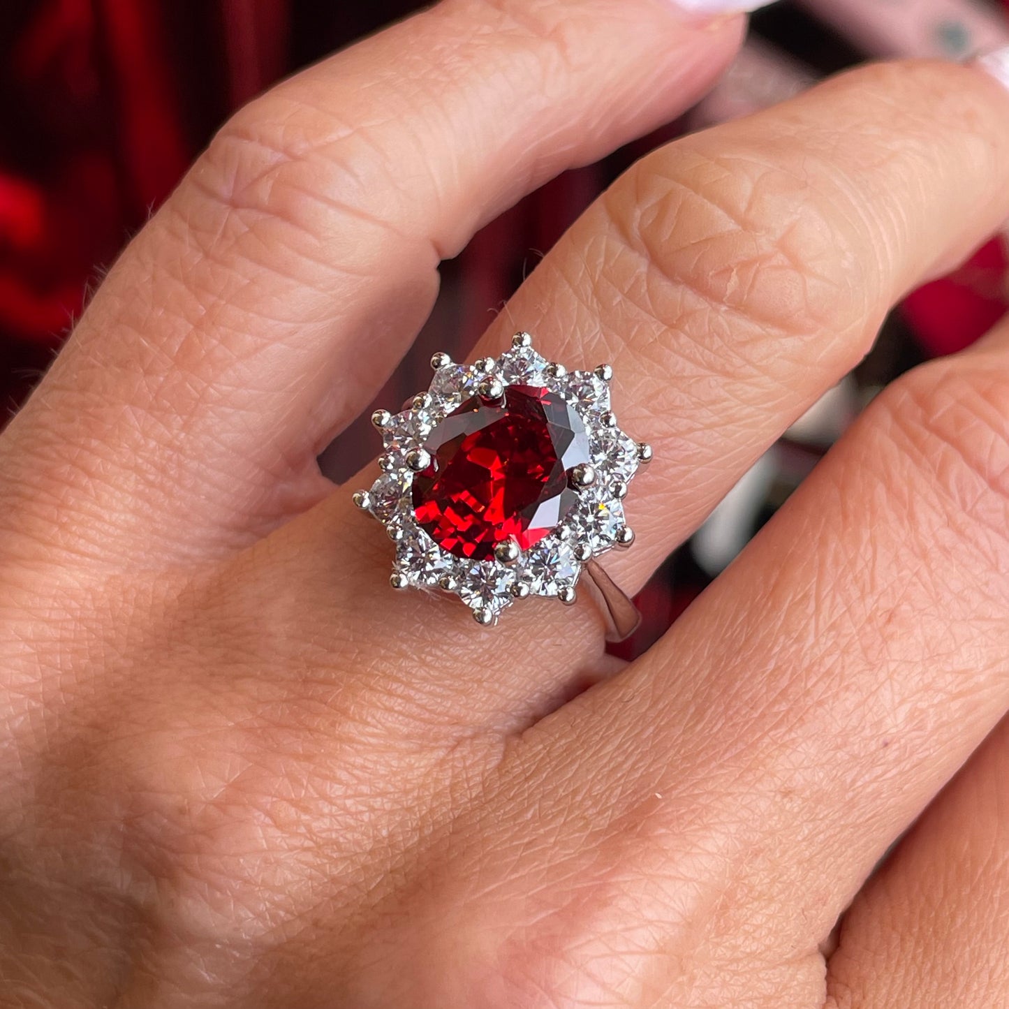 Silver garnet red oval statement ring by Comero with a bold, elegant design and a striking red oval gemstone.