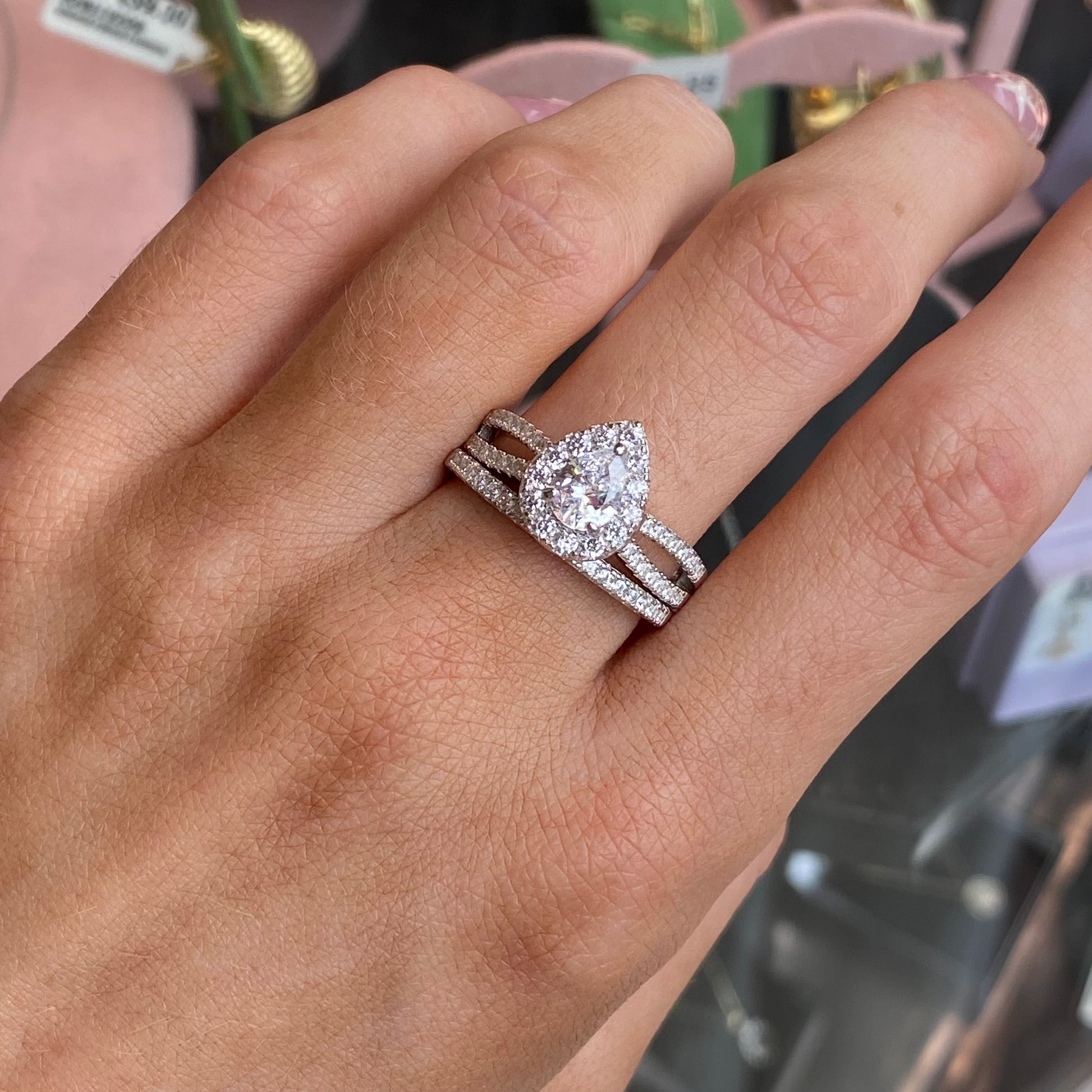 Silver Pear CZ bridal ring set by NJO featuring a sparkling pear-shaped cubic zirconia and matching bands.