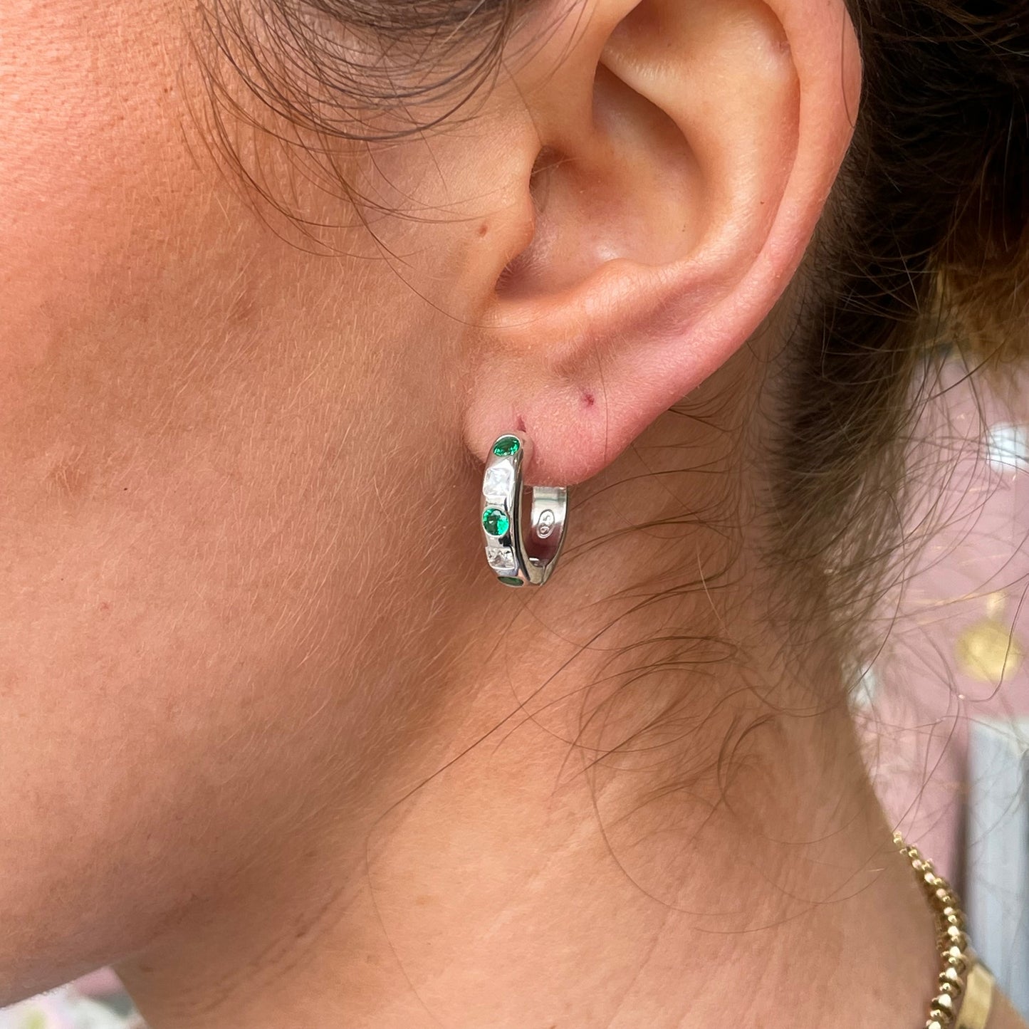 Silver green CZ hoop earrings by Comero featuring sparkling cubic zirconia stones and classic hoop design.